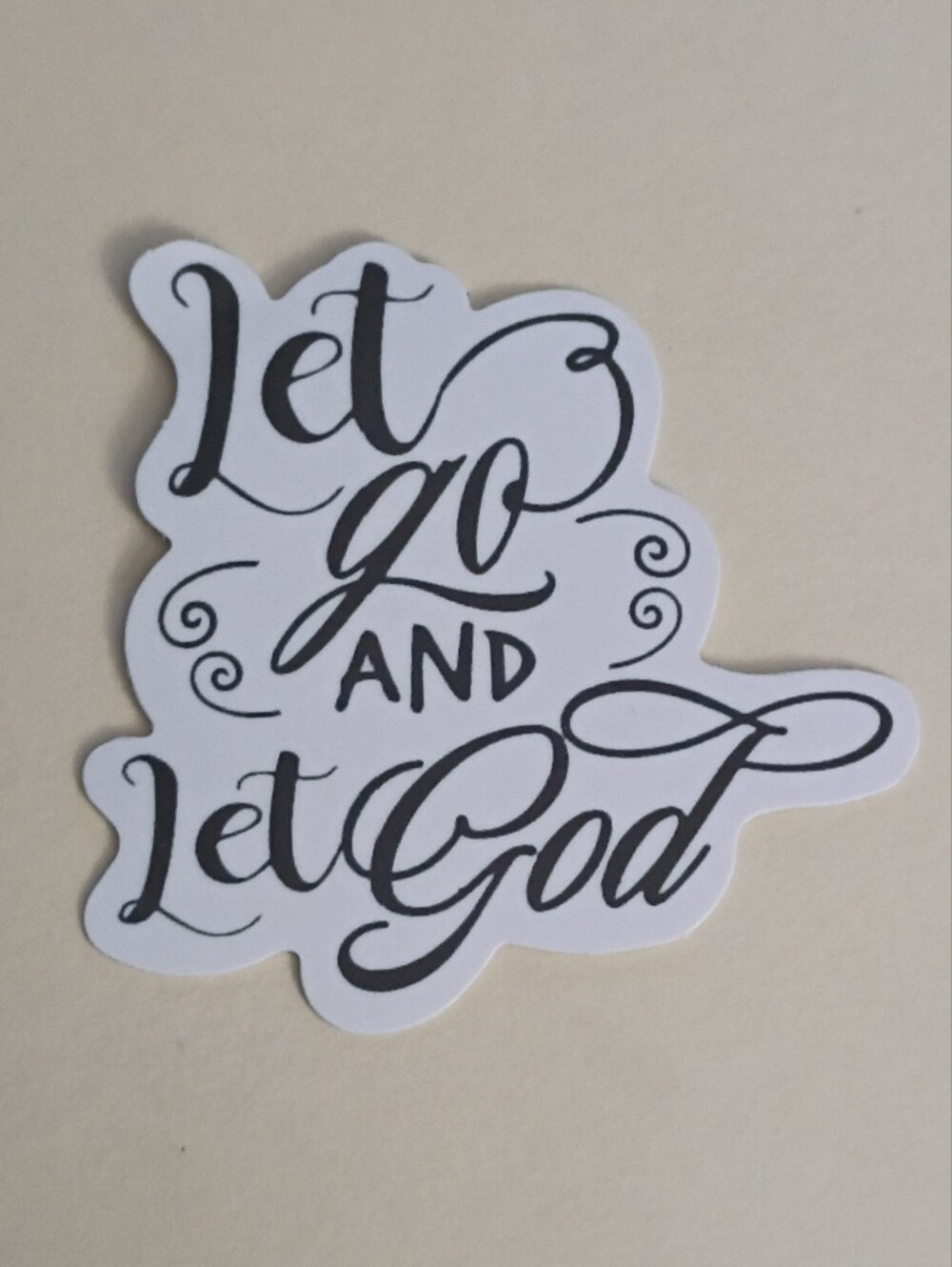 10/$10 Sticker - Let Go And Let God - Black Text & Cursive Font